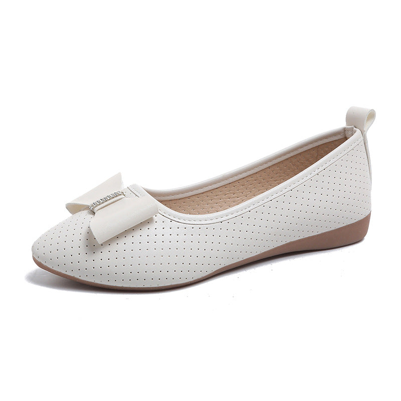 Un_par_de_zapatos_planos_blancos_1