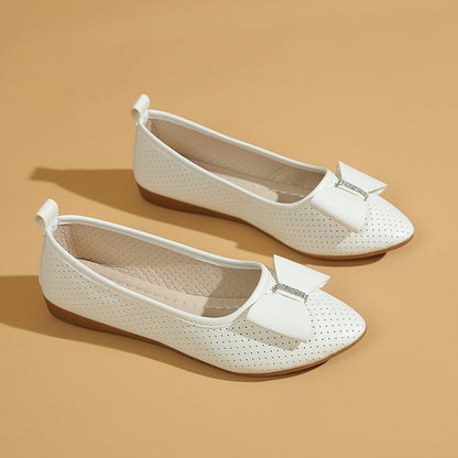Un_par_de_zapatos_planos_blancos_5